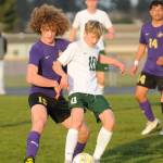 Sequim Gazette photo by Michael Dashiell / Sequims Sam Stewart, left, and Port Angeles Matthew Miller vie for the ball in an April 18 Olympic League game.