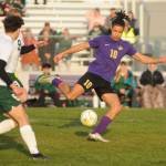 Sequim Gazette photo by Michael Dashiell / As Port Angeles Keane McClain (6) and David Hannes Spieker (9) look on, Sequims Mekhi Ashby looks for an open teammate in the first half of SHSs 1-0 win over the Roughriders on April 18.