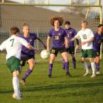 Sequim Gazette photo by Michael Dashiell / Port Angeles Kaleb Gagnon, left, looks to put a shot on goal in an April 18 game in Sequim, as Wolves (from left) Jack Henninger (24), Sam Stewart (15), Colin Feik (7) and Evan Cisneros (14) defend the play.