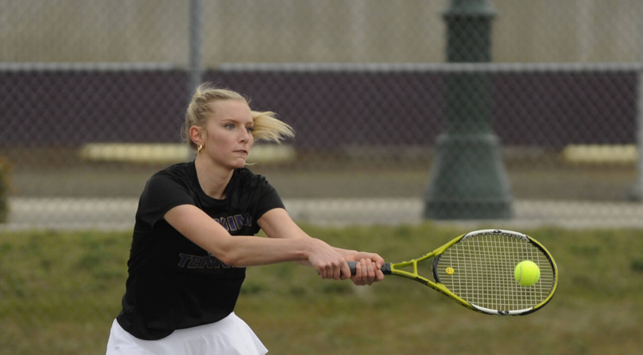 Sequim Gazette photoS by Michael Dashiell
Above: Sequims top singles player Kendall Hastings plays in a match against Olympic on April 21. Hastings beat Trojan Bailey Walton in straight sets (6-2, 6-3). Below: Sequims No. 2 singles player Calleigh Thompson returns a shot in a match against Olympic on April 21. Thompson edged Trojan Emlyn Coulter, 7-6 (7-4) and 6-2.