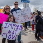 Sequim Gazette photo by Emily Matthiessen / Marie-Claire Bernards, Brian Webb and second-grader Weston Webb join dozens of protestors at the intersection of North Sequim avenue and Fir Street on April 17, as citizens protest the Sequim School Boards decision to reconfigure the districts two elementary schools.