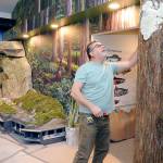 Hal Peterson, a co-owner of Ballard-based Mach 2 Arts, works on a fabricated tree on Wednesday that will become part of a mountains-to-sea diorama of regional landscapes at the Dungeness River Nature Center at Railroad Bridge Park in Sequim. (Keith Thorpe/Peninsula Daily News)