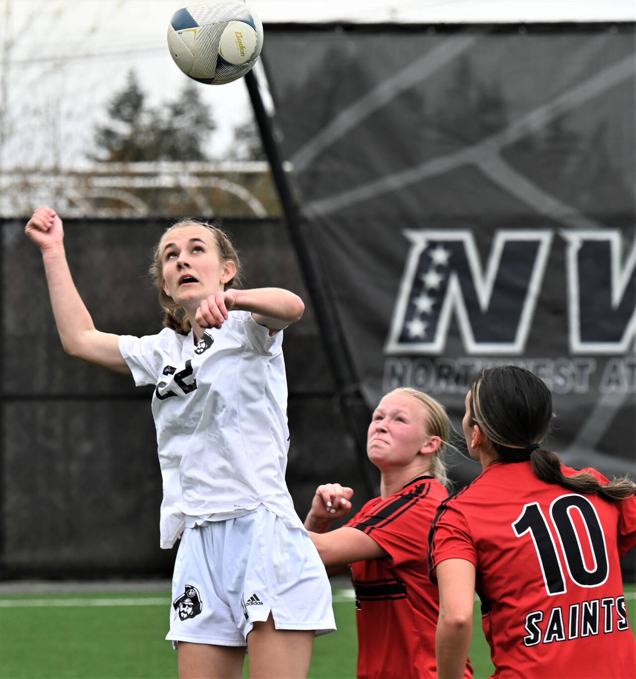 Photo by Rick Ross/Peninsula College / Sequim High grad Hannah Wagner gets her head on the ball as she and the Peninsula College Pirate womens soccer team take on  and beat  St. Martins University in an April 22 exhibition match in Port Angeles.