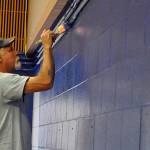 Sequim Gazette photo by Matthew Nash/ John Campbell with Dungeness Community Church paints a wall inside Helen Haller Elementarys cafeteria during Sequim Beautiful Day. It was his first time helping with the event, he said.
