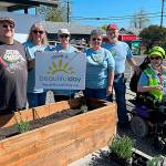 Sequim Gazette photos by Matthew Nash
At Sequim Food Bank, volunteers, from left, Kevin Wilson, Betty Gwaltyney, Corky Schadler, Melody Wilson, John Matson, and Melissa Vemi with Sequim Community Church, worked together to build two planters, fill them with dirt and plant lavender for Sequim Beautiful Day. Not pictured was Steve Gale.