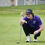Sequims Carter Cronin lines up a putt on the fourth hole at The Cedars at Dungeness, in a league match against Olympic on April 26. Cronin was medalist for the match with a round of 40.