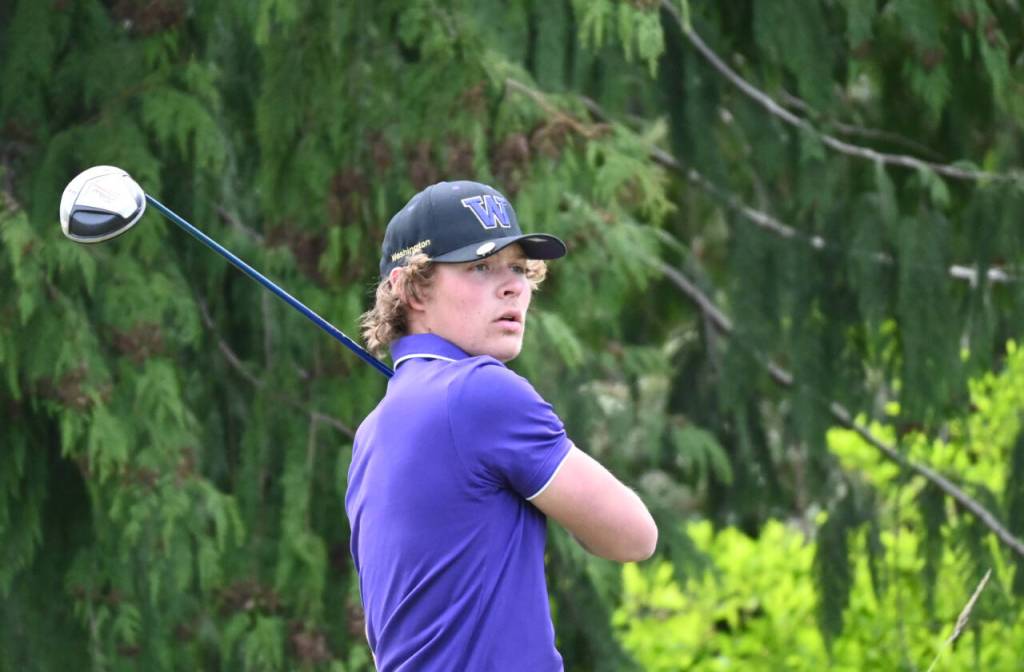 Sequim Gazette photo by Michael Dashiell / Sequims Zack Thompson watches a drive off the second tee at The Cedars at Dungeness on April 25. Thompson shot a 43 as the Wolves topped Olympic by 20 shots.