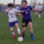 Sequim Gazette photo by EmilyMatthiessen / Sequim midfielder Solas McGruther, right, battles with North Kitsaps Austin Stricklin for the ball in an April 24 Olympic League game in Sequim on April 25. North Kitsap edged the Wolves, 2-0.