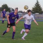 Sequim Gazette photo by EmilyMatthiessen / Sequims Jack Henninger, left and North Kitsaps Trevor Flowers look to gain possession in an April 24 Olympic League game in Sequim. Flowers Vikings topped the Wolves, 2-0.