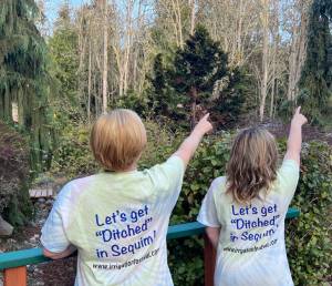 Photo courtesy of Sequim Irrigation Festival / Volunteers with the 128th Sequim Irrigation Festival receive exclusive Lets Get Ditched in Sequim T-shirts.