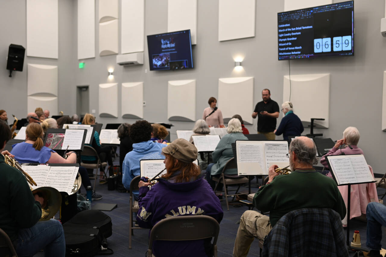 Photo by Richard Greenway/Sequim City Band
Sequim City Band members assemble for their first rehearsal in the new rehearsal hall at the James Center. The hall features a high ceiling, acoustical tiles on the walls and wall-mounted monitors for displaying key information.