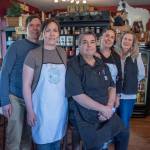 Sequim Gazette photoS by Emily Matthiessen
Chef Ted Walker, sitting, and, from left to right: Joe Manney, Emily Walker, Amy Shea and Ann Walker are the family behind Carlsborgs new eatery, The Goat and the Radish. Not pictured is Sheas husband, Justin, who the family referred to as a carpenter extraordinaire.