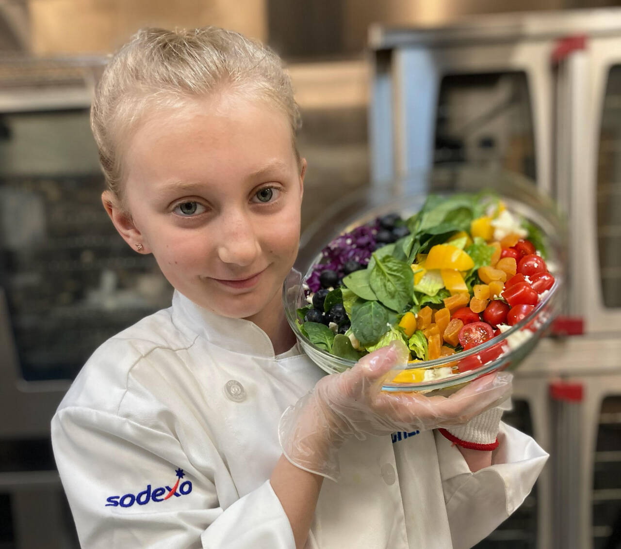 Photo by Jarrett Nelson / Brynn Kendall displays her winning recipe for "Brynn's Refreshing Rainbow Salad" at the Sequim School District's central kitchen.