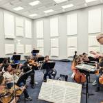 Photo courtesy of Sequim Community Orchestra / Conductor/music director Phil Morgan-Ellis leads a Sequim Community Orchestra rehearsal on April 25 at the Sequim City Band expanded rehearsal hall at the James Center for Performing Arts. The orchestra closes their 11th season with a free concert and bake sale at 7 p.m. on Saturday, May 13, at Trinity United Methodist Church.