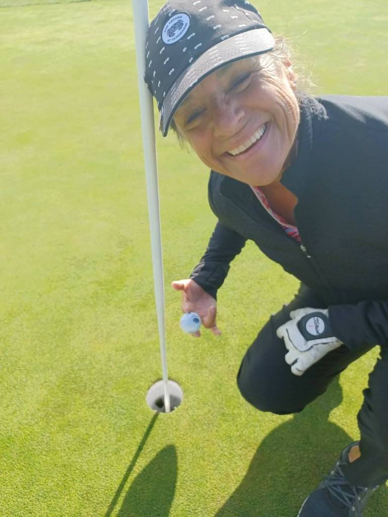 Photo courtesy of Cedars At Dungeness Womens Golf Association / Anne Elwell on May 2 celebrates her first hole-in-one, on a par-3, 115-yard uphill hole at The Cedars at Dungeness.