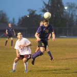 Sequim Gazette photo by Michael Dashiell / Sequims James Mason, right, gets his head on the ball in the second half of a match-up with Kingston on May 4. Looking on is Buccaneer Evan Garcia.