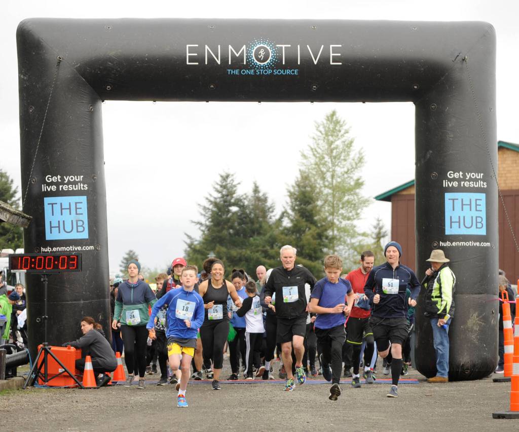 Sequim Gazette photo by Michael Dashiell / Runners and walkers in the Sequim Irrigation Festival 5k on May 6 break from the starting line.