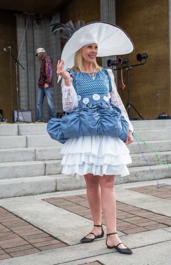 Sequim Gazette photo by Emily Matthiessen / Cherie Hendrickson models the winning creation at the Sequim Irrigation Festivals first Trashion Show on May 6. The event was emceed by Conor Dowley (background).