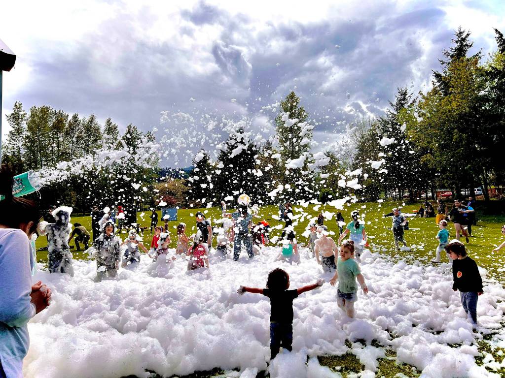 Photo by Stacy Graves
Youngsters enjoy the Strait Up Foam Fun feature at the Family Fun Day at Carrie Blake Community Park on May 7. (See more of Graves photos at magiccapturedbystacy.com)