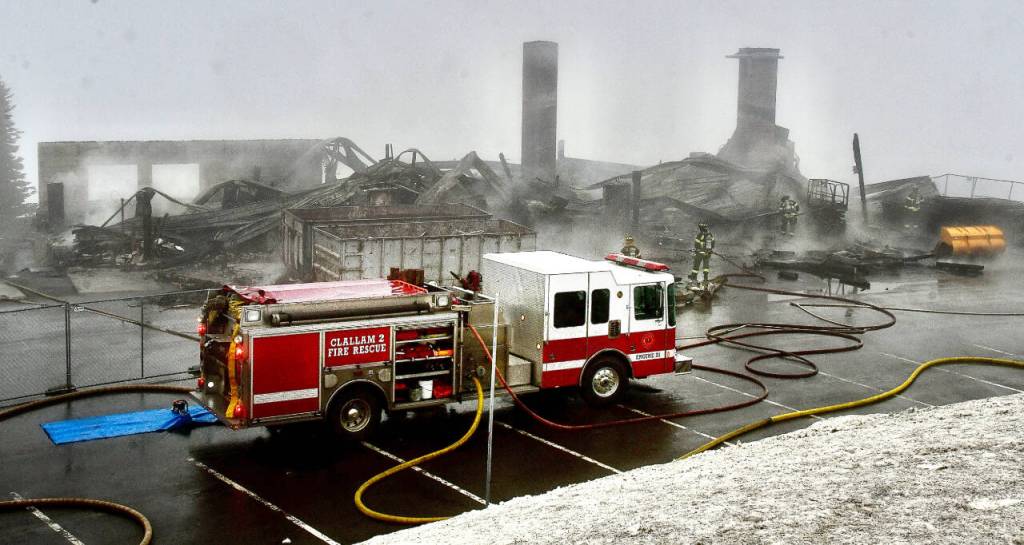 Photo by Jay Cline/Clallam County Fire District 2 / Firefighters from Clallam 2 Fire-Rescue and the Port Angeles Fire Department respond to a fire at the Olympic National Park Day Lodge on May 7.