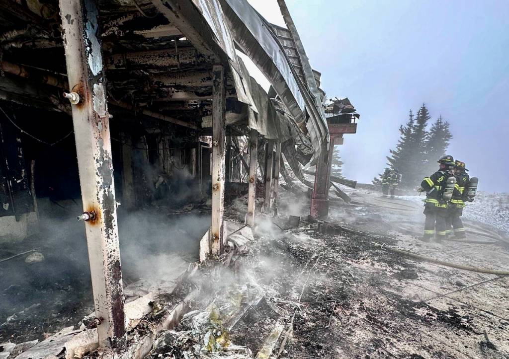 Photo by Jay Cline/Clallam County Fire District 2 / Firefighters from Clallam 2 Fire-Rescue and the Port Angeles Fire Department oversee extinguishing a fire at the Olympic National Park Day Lodge on May 7.