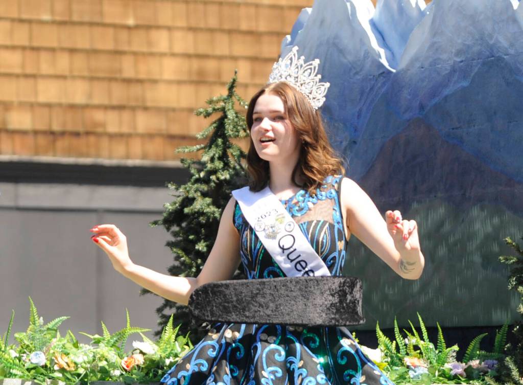 Sequim Gazette photo by Michael Dashiell / Sequim Irrigation Festival queen Pepper Reymond enjoys some tunes as she and festival royalty say hello to the Grand Parade crowd on Saturday, May 13.