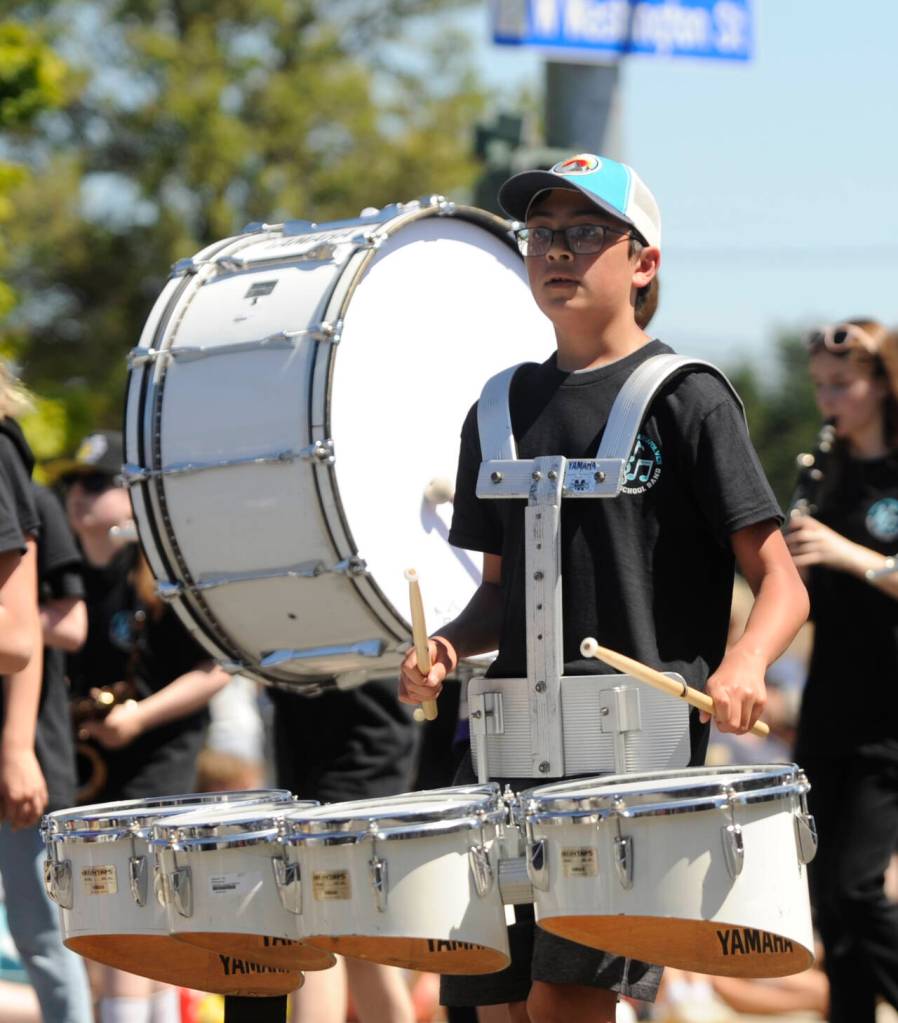Sequim Gazette photo by Michael Dashiell / Sequim High School and Sequim Middle School band members entertain the crowd at the Sequim Irrigation Festival Grand Parade on Saturday, May 13.