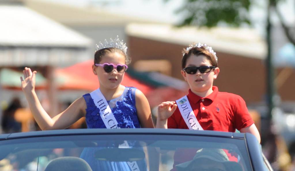 Sequim Gazette photo by Michael Dashiell / Junior Royalty Sophia Lopez and Greyson Rhodes, Of Greywolf Elementary School, wave to the Sequim Irrigation Festival Grand Parade crowd on May 13.