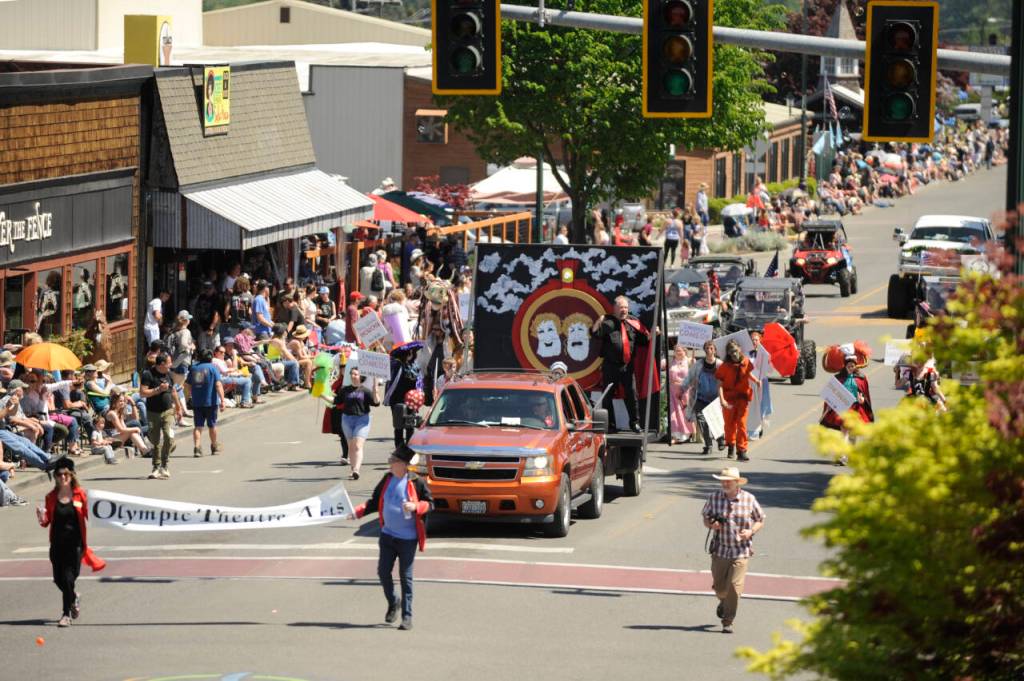 Sequim Gazette photo by Michael Dashiell
Decked out in various costumes, thespians and crews from Olympic Theatre Arts productions greet attendees of the Sequim Irrigation Festival Grand Parade on May 13.