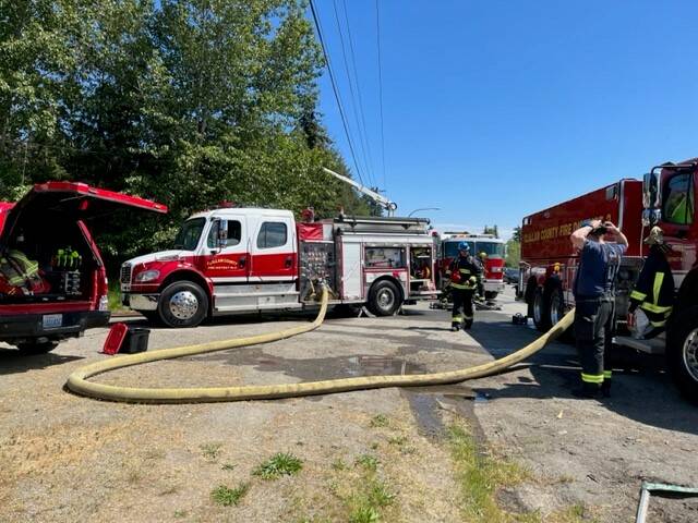 Photo courtesy of Clallam County Fire District 3 / Firefighters with Clallam County Fire District 3 respond to a recreational vehicle fire on Cliff Robinson Road on May 15.