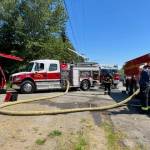Photo courtesy of Clallam County Fire District 3 / Firefighters with Clallam County Fire District 3 respond to a recreational vehicle fire on Cliff Robinson Road on May 15.