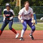 Photo by Kevin Hanson / Sequim's Sammie Bacon, right, keeps a Lindbergh baserunner close at first base in a West Central District tourney opener on May 20 in Lacey. Bacon had 4 RBIs in a 17-0 Sequim victory. The Wolves came within one win of a state 2A tourney berth.