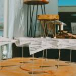 The history of the Olympic Peninsula is mapped onto tree rings from a 200-year-old Douglas Fir that used to stand by Lake Crescent, on display at the Olympic Rounds booth at the Sequim Farmers & Artisans Market.