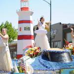 Sequim Gazette file photo by Michael Dashiell / Royalty from the Tacoma Daffodil Festival wave to the Sequim Irrigation Festival Grand Parade crowd on May 13. The entry took home the Grand Sweepstakes award.