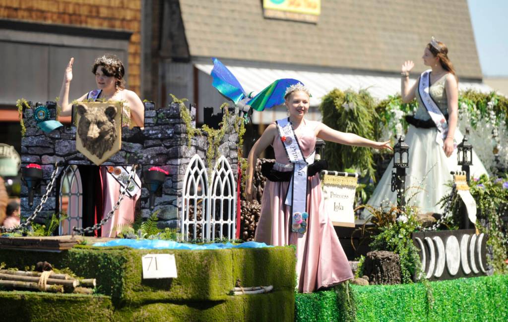 Sequim Gazette file photo by Michael Dashiell / Royalty from the McCleary Bear Festival say hello to the Sequim Irrigation Festival Grand Parade crowd on May 13. The entry took home the Mayors Award.
