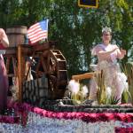 Sequim Gazette file photo by Michael Dashiell / Wild Wild Rhody Festival royalty Melody Douglas, left, and Paige Govia wave to the crowd at the Sequim Irrigation Festival Grand Parade on May 13. The float took home the Presidents Award following the parade.