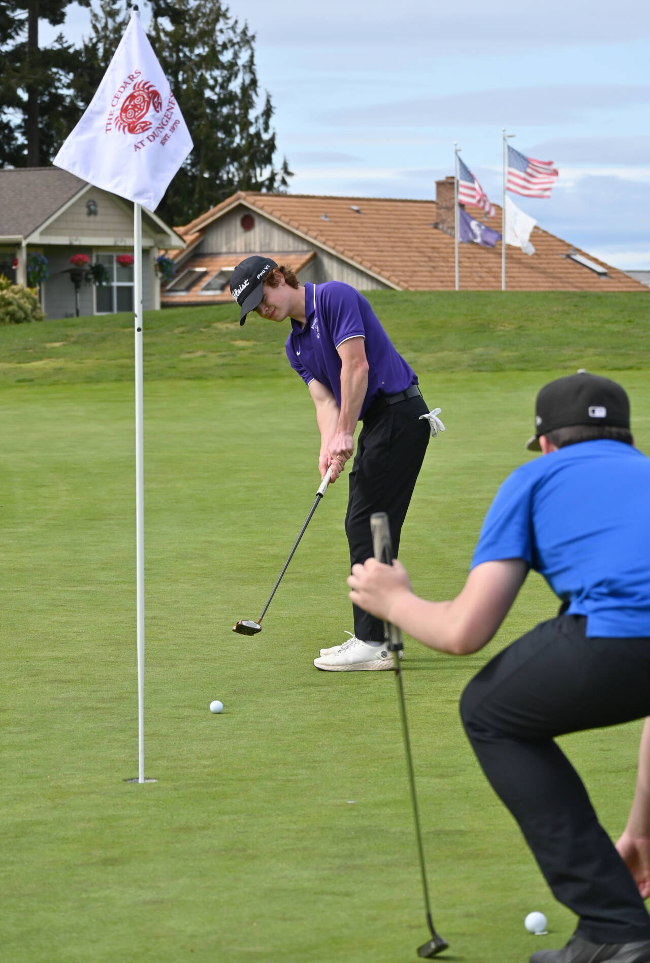 Sequim Gazette photo by Michael Dashiell / Sequims Carter Cronin lines up a putt on the fourth hole at The Cedars at Dungeness, in a league match against Olympic on April 26. Cronin earned a state tourney berth after winning a three-player playoff for the the West Central District tournament title on May 16 at The Cedars.