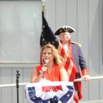 Sequim Gazette photo by Michael Dashiell / Emcee Greta Christianson introduces honored guests at the Olympic Peninsula Academy flagpole dedication ceremony on May 18. The flagpole project was a partnership between the school and the Michael Trebert Chapter of the Daughters of the American Revolution, along with a number of community sponsors.