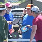 Sequim Gazette photo by Michael Dashiell / Mike Richer, left, and Kevin Jenks share post-match congrats with Cindi Pettit, far left, and Sherri Gyovai in the championship match at the Big Dill Fun Day tournament at Carrie Blake Community Park on May 20.