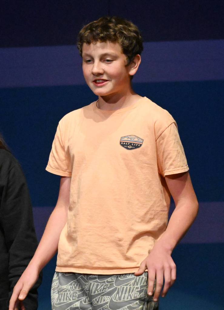 Sequim Gazette photo by Michael Dashiell / Gabe Robbins helps lead a song during a rehearsal for Olympic Peninsula Academys musical comedy, The Nifty Fifties.