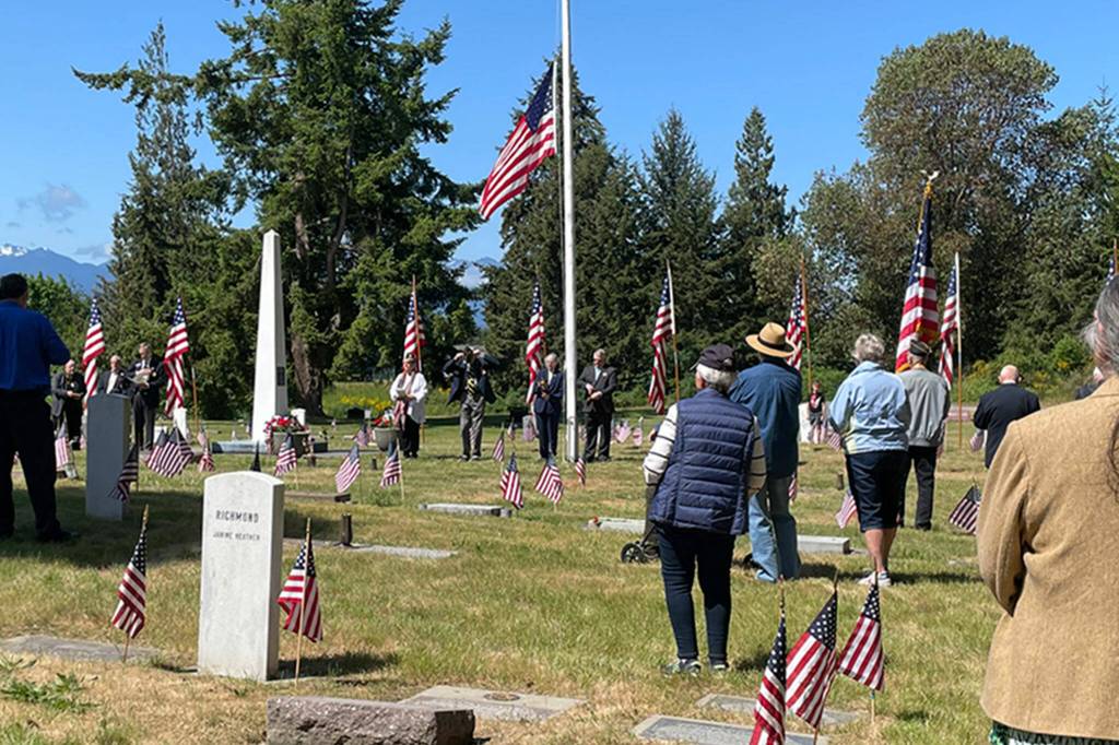 Sequim Gazette photo by Matthew Nash/ Dozens of people attend a Memorial Day service on May 29 in Sequim View Cemetery on May 29. It was one of a few ceremonies held in area cemeteries.