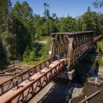 Photo by Jesse Major/Rails-to-Trails Conservancy
Washington state Gov. Jay Inslee, third from left, and his team ride across the bridge at Railroad Bridge Park on the Olympic Discovery Trail on June 7.