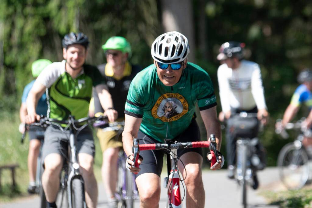 Photo by Jesse Major/Rails-to-Trails Conservancy
Washington state Gov. Jay Inslee rides on the Olympic Discovery Trail east of Sequim on June 7. The Rails-to-Trails Conservancy honored Inslee as its 2023 Rail-Trail champion during an event at Red Cedar Hall in Blyn following Inslees 27-mile ride from Port Angeles.