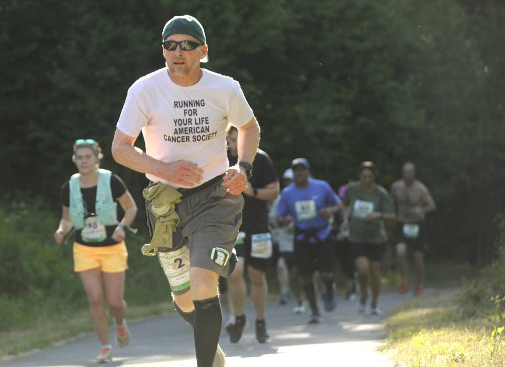 Sequim Gazette photos by Michael Dashiell
Tom Wahl of Port Angeles and other runners in the North Olympic Discovery Marathon reach the outskirts of Sequim on June 4.