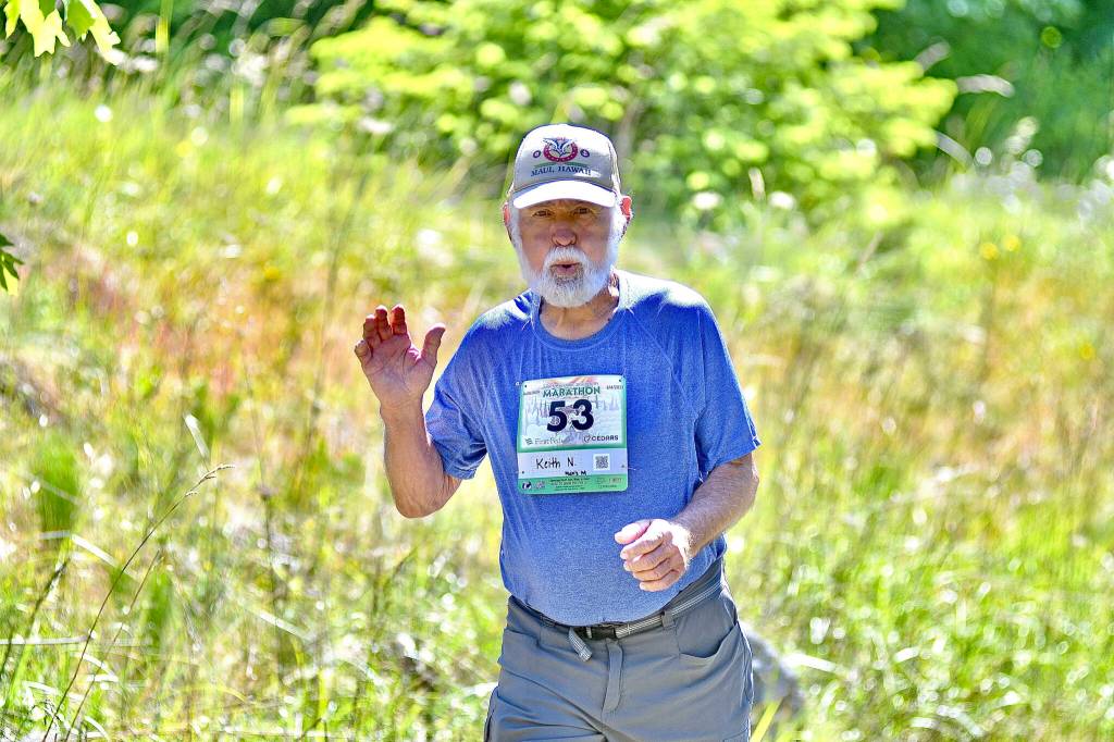 Photo by Jay Cline / Keith Northington, 84, of Sequim, races in the North Olympic Discovery Marathon on June 4. Northington finished in 7:18:02. The oldest runner in this years race, Northington cruised to a win in his age class (men 80-89).
