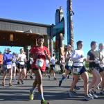 Sequim Gazette photo by Michael Dashiell 
Chanelle Lansley of Seattle is all smiles as she and other full North Olympic Discovery Marathon runners break from the start in Blyn on June 4. See story, more photos on B-5.