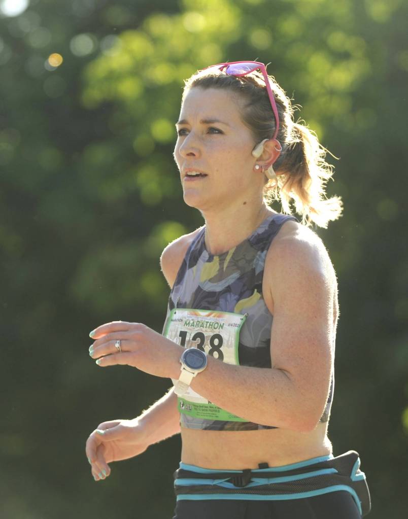Sara King of Seattle grabs an early lead in the North Olympic Discovery Marathon on June 4. King won the womens division of the full marathon and was seventh overall, finishing in 3 hours, 12 minutes, 16 seconds.