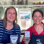 Photo courtesy of Christina Norman / Teresa Crecelius, left, of Cascade Caramel, and Christina Norman of WeDo Fudge offer treats and prayer at the WeDo Fudge drive-thru stand in Carlsborg.