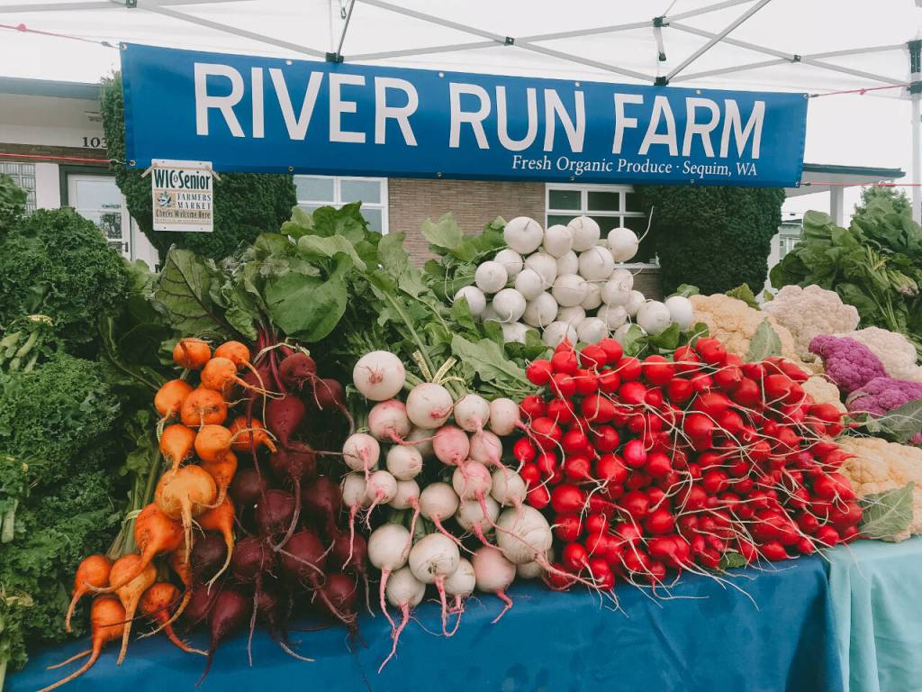Photo courtesy of Sequim Farmers & Artisans Market
A variety of organically-grown produce fills the River Run Farms booth at the Sequim Farmers & Artisans Market.
