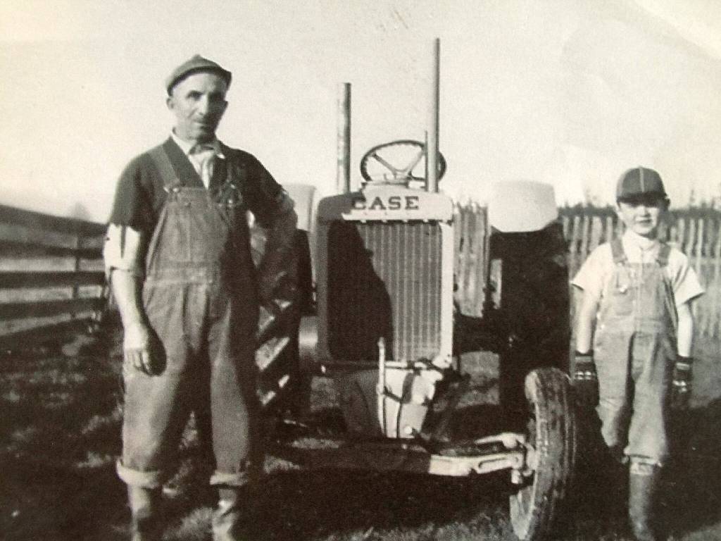 Photo courtesy of Angiuli family/ Trifone and Jerry Angiuli stand together while working on their Sequim family farm.